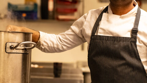 chef in kitchen cooking