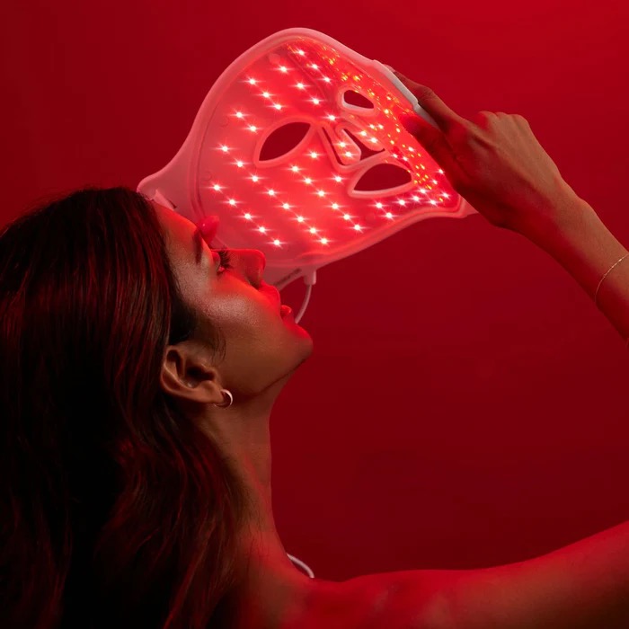 Woman with With Omnilux LED Therapy mask